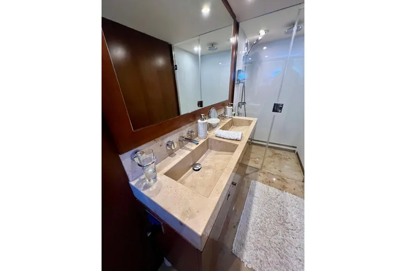  Yacht Photos Pics Luxurious bathroom in 2010 Princess V78 yacht with dual sinks and glass shower.
