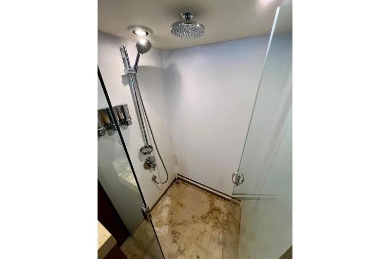  Yacht Photos Pics Luxurious shower in 2010 Princess V78 yacht with glass door and modern fixtures.