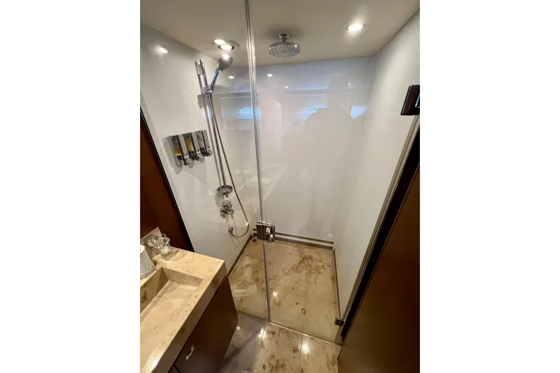  Yacht Photos Pics Luxurious shower area in 2010 Princess V78 yacht with modern fixtures and marble flooring.