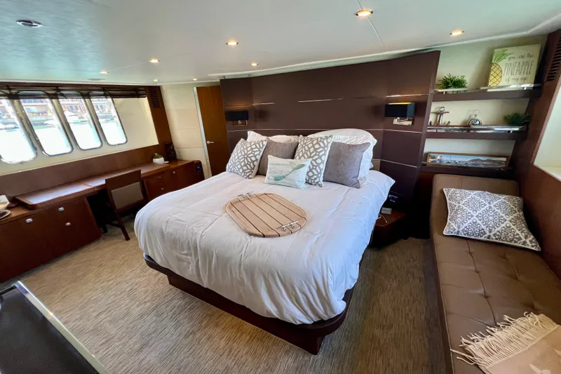  Yacht Photos Pics Luxurious bedroom interior of 2010 Princess V78 yacht with elegant decor and ample natural light.