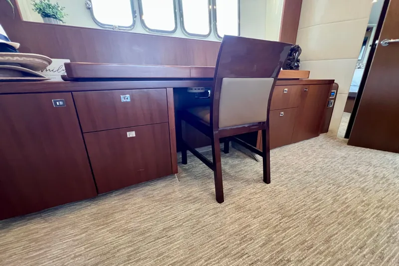  Yacht Photos Pics Luxurious interior of 2010 Princess V78 yacht with wooden desk and chair.