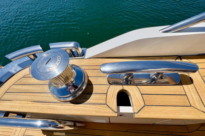  Yacht Photos Pics Deck of 2010 Princess V78 yacht with polished metal fittings and teak wood finish.