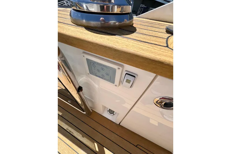  Yacht Photos Pics Control panel on 2010 Princess V78 yacht deck with wood finish.