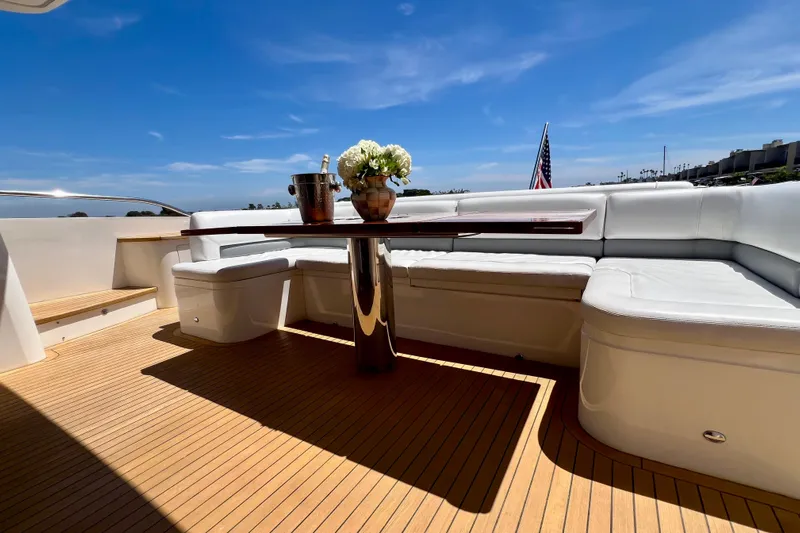  Yacht Photos Pics Luxurious 2010 Princess V78 yacht deck with seating, table, and ocean view.