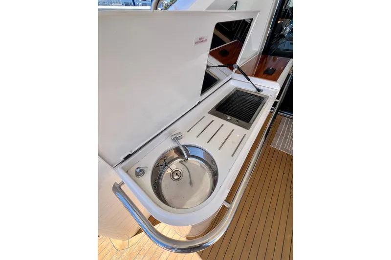  Yacht Photos Pics Outdoor kitchen area on 2010 Princess V78 yacht with sink and grill.
