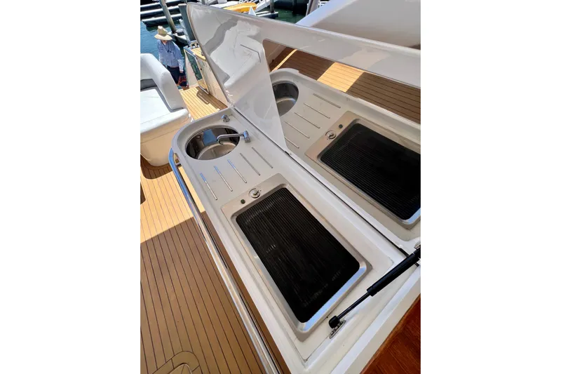  Yacht Photos Pics Outdoor kitchen area on a 2010 Princess V78 yacht with grill and sink.