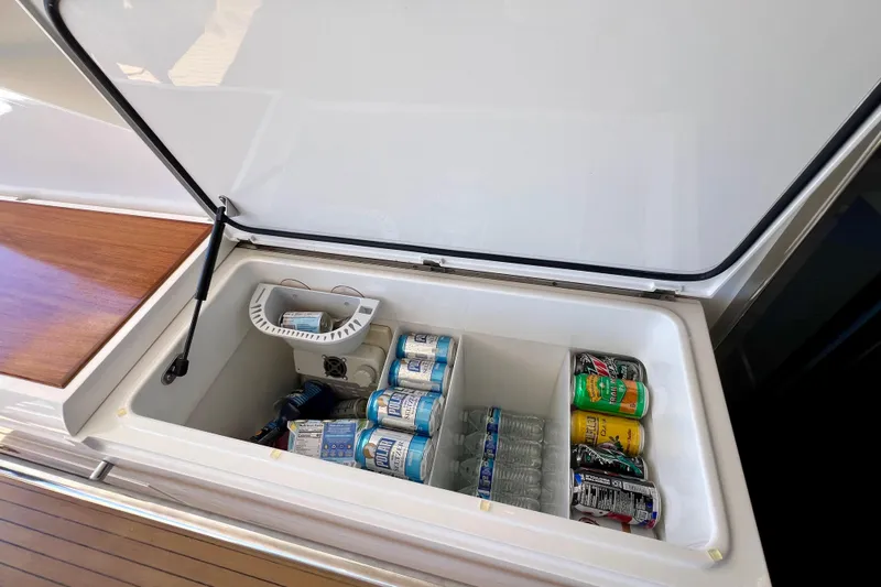  Yacht Photos Pics Open cooler on 2010 Princess V78 yacht, stocked with drinks and water bottles.