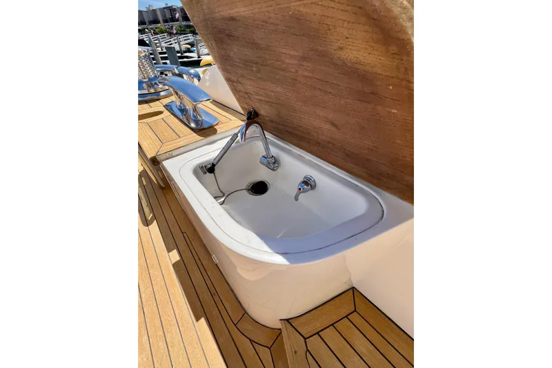  Yacht Photos Pics Outdoor sink on 2010 Princess V78 yacht with wooden deck.