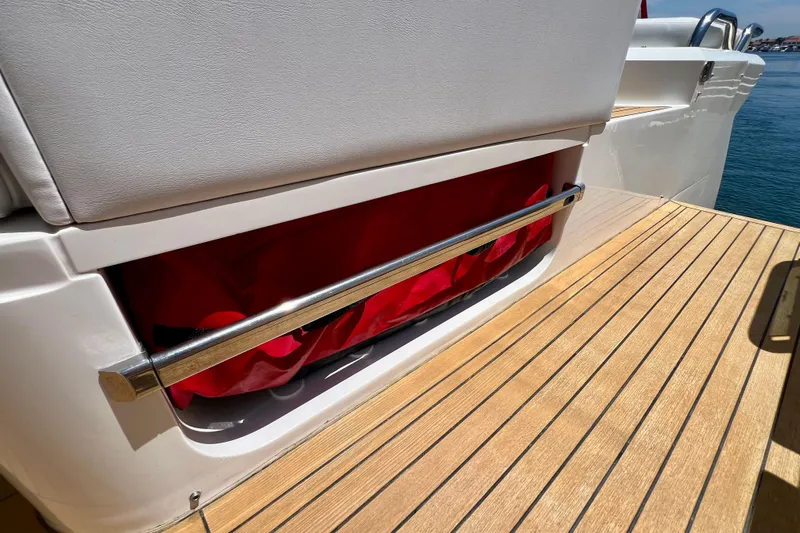  Yacht Photos Pics 2010 Princess V78 yacht deck with storage compartment and red cover.