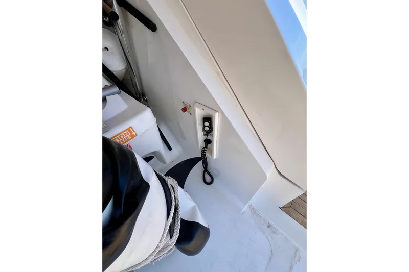  Yacht Photos Pics Control panel on 2010 Princess V78 yacht deck with coiled cable and safety equipment.