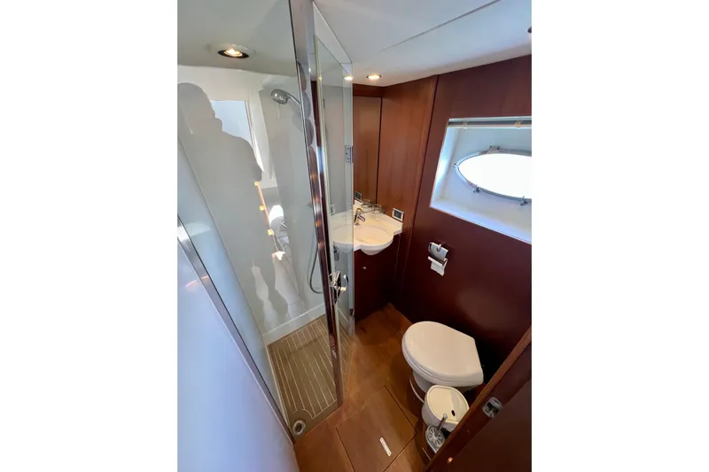 Yacht Photos Pics Luxurious bathroom in 2010 Princess V78 yacht with modern fixtures and wooden accents.