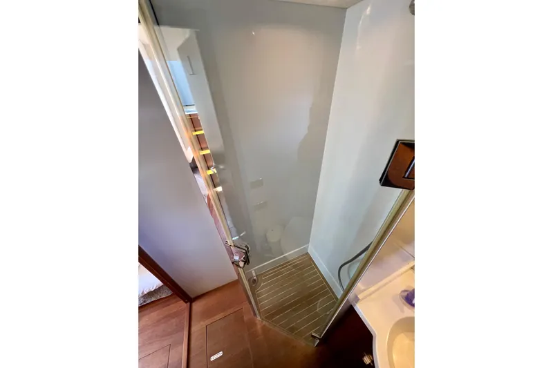  Yacht Photos Pics Shower area in 2010 Princess V78 yacht with wooden flooring and glass door.