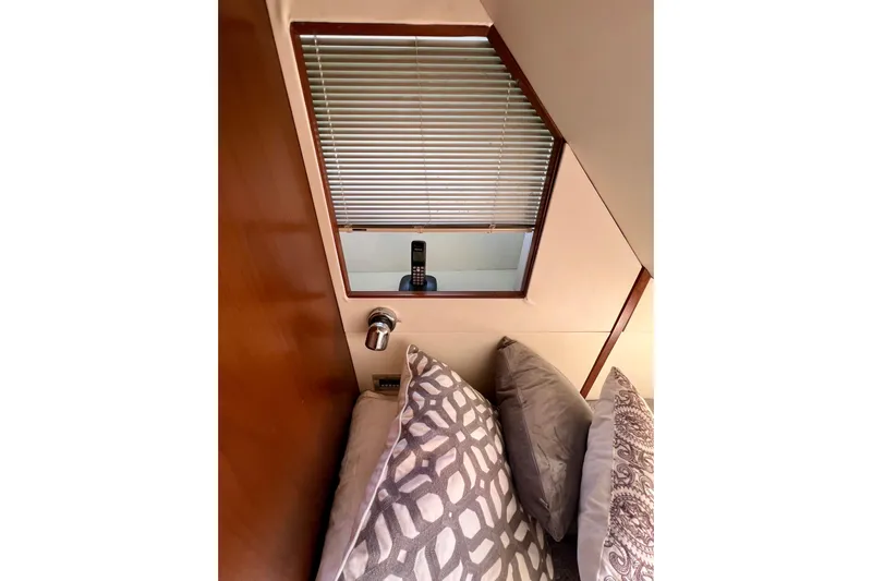  Yacht Photos Pics Interior of 2010 Princess V78 yacht with patterned pillows and window blinds.