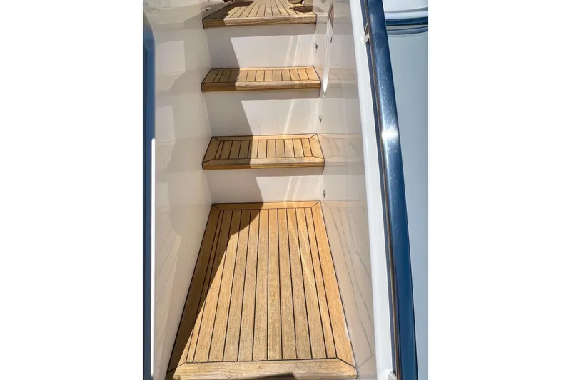  Yacht Photos Pics Wooden steps on a 2010 Princess V78 yacht, featuring sleek design and polished finish.