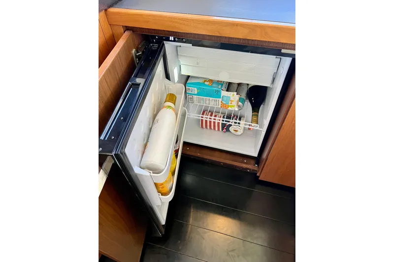  Yacht Photos Pics Mini fridge in 2010 Princess V78 yacht, stocked with beverages and snacks.