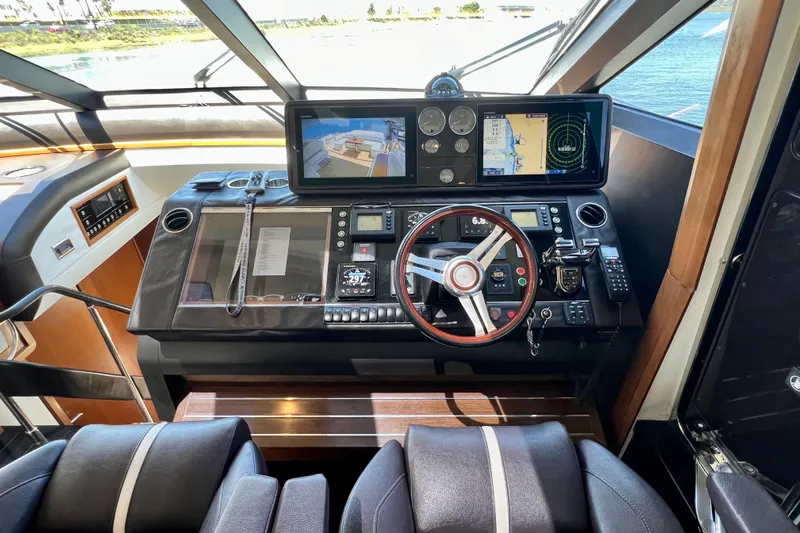  Yacht Photos Pics Cockpit of 2010 Princess V78 yacht with advanced navigation controls and displays.