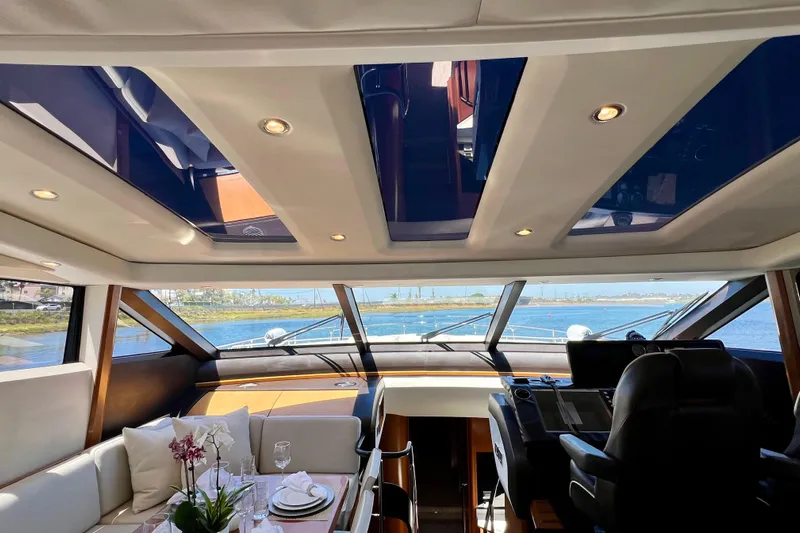  Yacht Photos Pics Luxurious interior of 2010 Princess V78 yacht with panoramic windows and elegant dining setup.