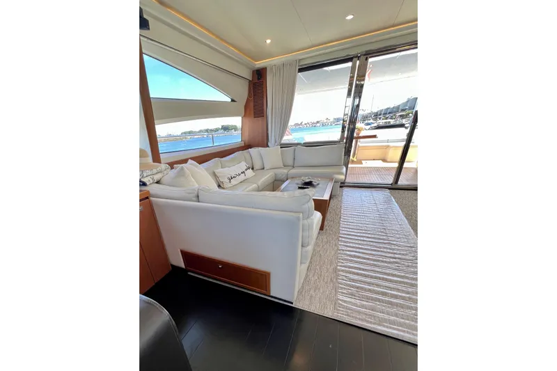  Yacht Photos Pics Luxurious interior of 2010 Princess V78 yacht with white seating and ocean view.