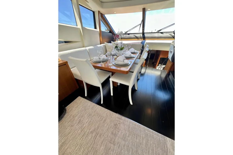  Yacht Photos Pics Luxurious dining area on 2010 Princess V78 yacht with elegant table setting.