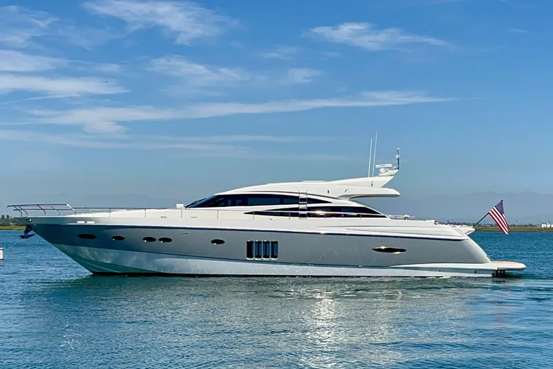  Yacht Photos Pics Luxury 2010 Princess V78 yacht on calm water under clear blue sky.