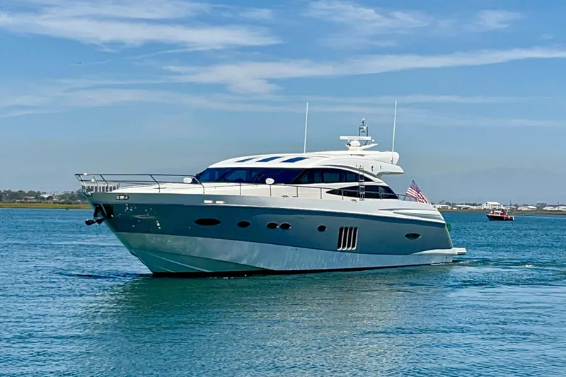  Yacht Photos Pics Luxurious 2010 Princess V78 yacht cruising on calm blue waters.