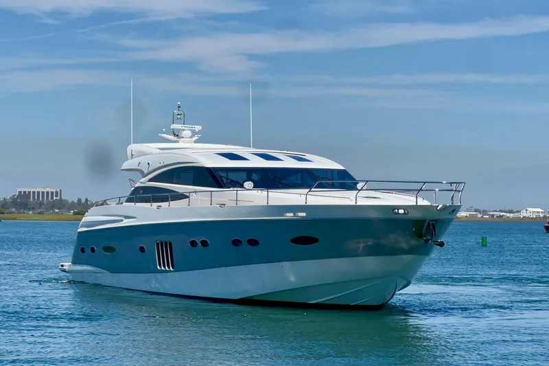  Yacht Photos Pics Luxurious 2010 Princess V78 yacht cruising on a sunny day.