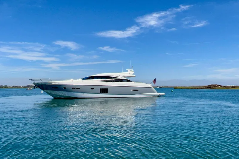  Yacht Photos Pics Luxurious 2010 Princess V78 yacht cruising on clear blue waters under a sunny sky.