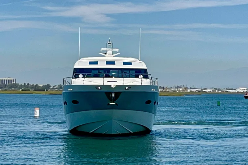  Yacht Photos Pics Front view of a 2010 Princess V78 yacht on calm water.