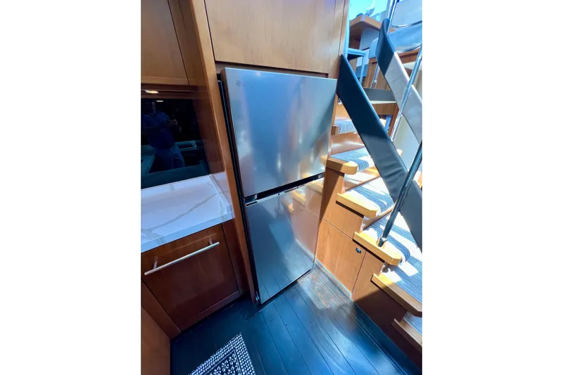  Yacht Photos Pics Modern kitchen area on 2010 Princess V78 yacht with stainless steel fridge.