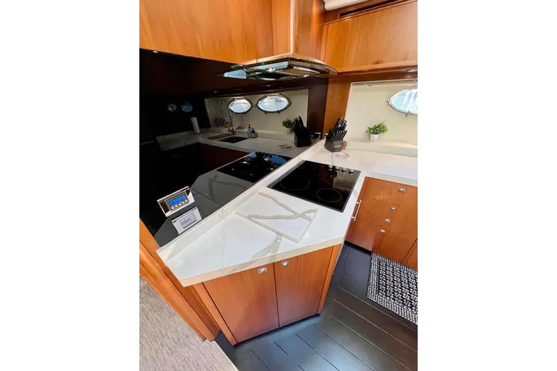  Yacht Photos Pics Luxurious kitchen interior of 2010 Princess V78 yacht with modern appliances and sleek design.