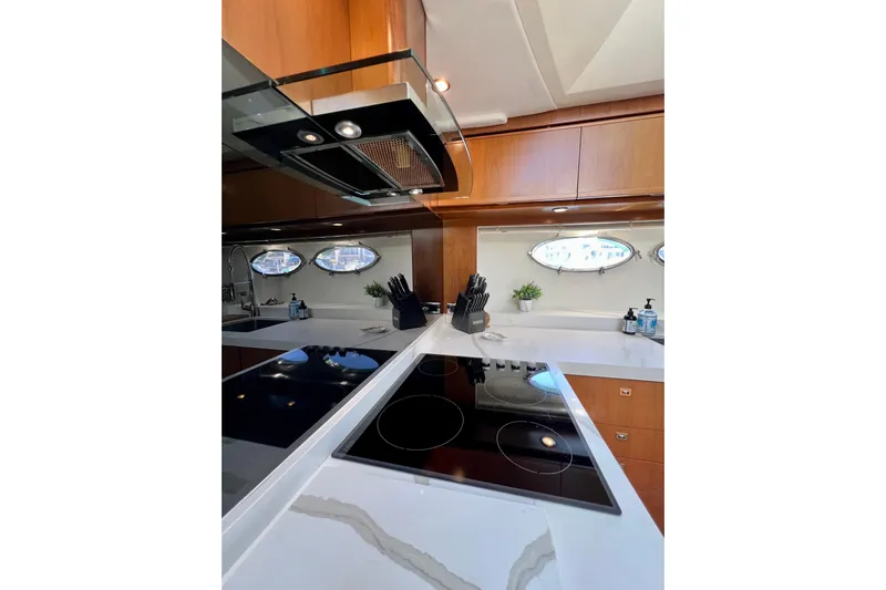  Yacht Photos Pics Luxurious kitchen interior of 2010 Princess V78 yacht with modern appliances and sleek design.