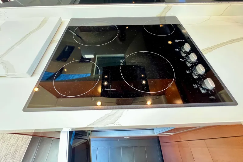  Yacht Photos Pics Modern electric stovetop on a 2010 Princess V78 yacht kitchen counter.