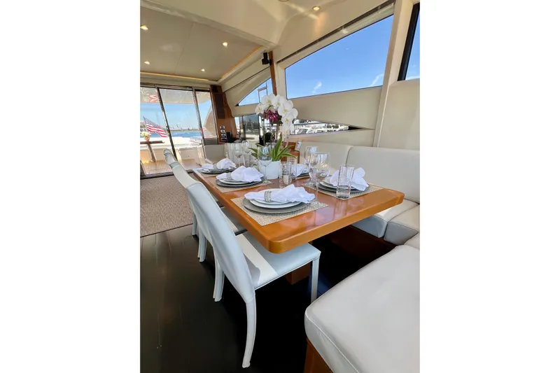  Yacht Photos Pics Luxurious dining area on 2010 Princess V78 yacht with elegant table setting.