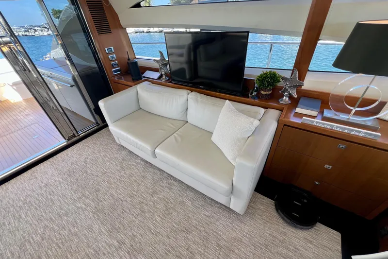  Yacht Photos Pics Luxurious interior of 2010 Princess V78 yacht with sofa, TV, and ocean view.