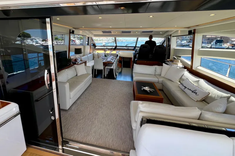  Yacht Photos Pics Luxurious interior of 2010 Princess V78 yacht with elegant seating and scenic marina views.