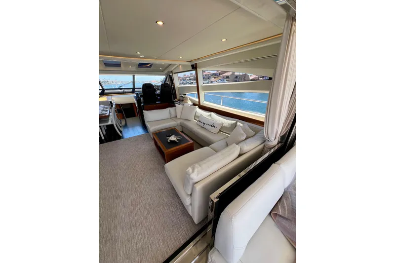  Yacht Photos Pics Luxurious interior of 2010 Princess V78 yacht with elegant seating and scenic views.