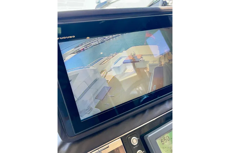  Yacht Photos Pics Control panel view on a 2010 Princess V78 yacht, displaying rear deck and water.