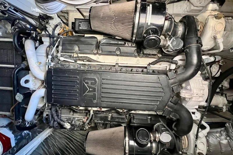  Yacht Photos Pics Engine of a 2010 Princess V78 yacht, featuring CAT branding and intricate mechanical components.