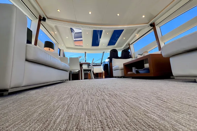  Yacht Photos Pics Luxurious interior of 2010 Princess V78 yacht with modern furnishings and panoramic windows.