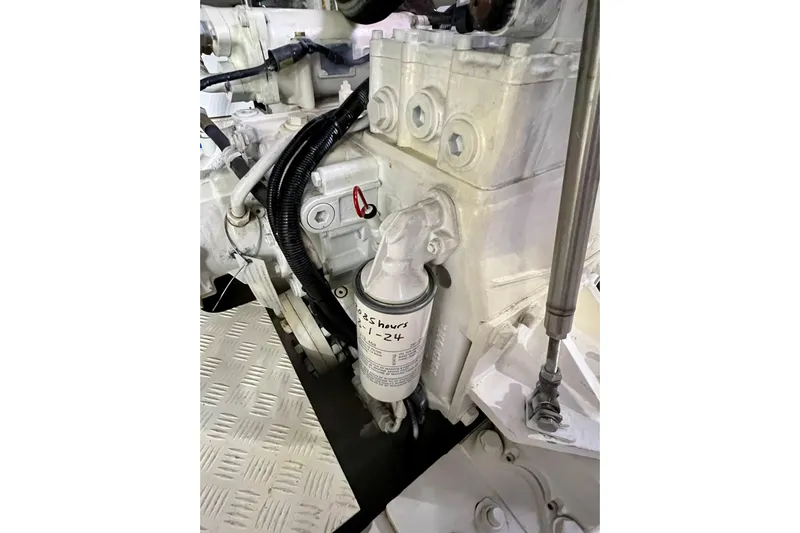  Yacht Photos Pics Engine compartment of a 2010 Princess V78 yacht, showcasing mechanical components and filter details.