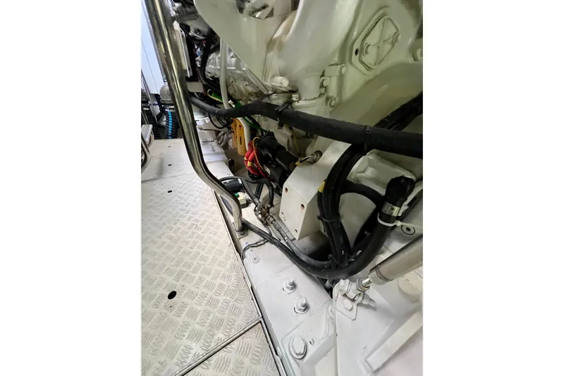  Yacht Photos Pics Engine compartment of a 2010 Princess V78 yacht, showcasing mechanical components and wiring.