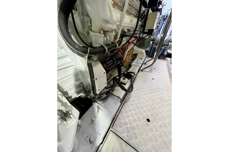  Yacht Photos Pics Engine room of 2010 Princess V78 yacht, showcasing mechanical components and wiring.