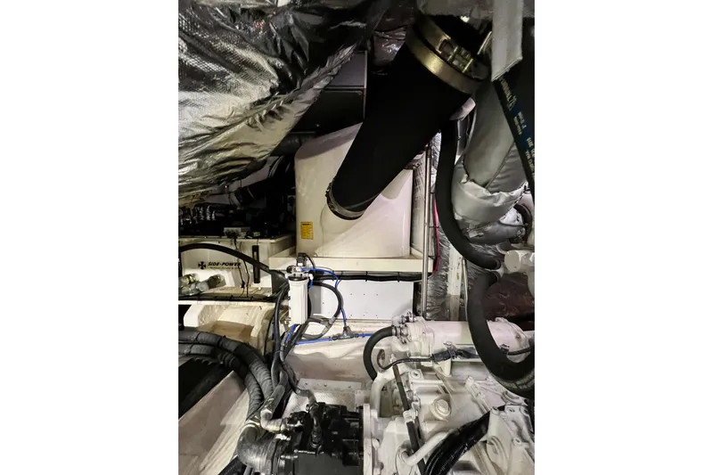  Yacht Photos Pics Engine room of 2010 Princess V78 yacht with visible machinery and hoses.