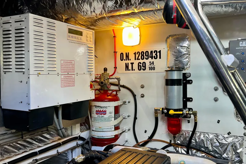  Yacht Photos Pics Engine room of 2010 Princess V78 yacht with fire suppression system and control panel.