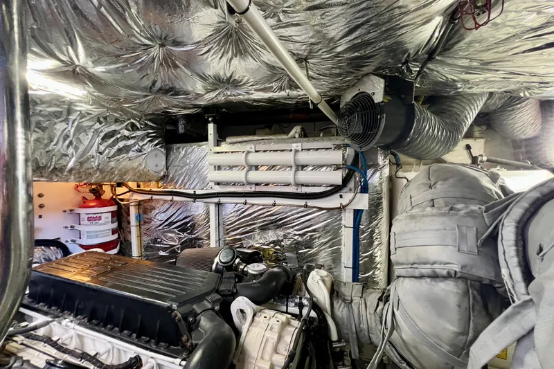  Yacht Photos Pics Engine room of 2010 Princess V78 yacht with insulated walls and mechanical components.