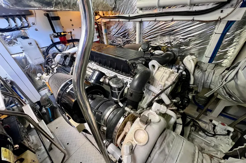  Yacht Photos Pics Engine room of a 2010 Princess V78 yacht, showcasing complex machinery and components.