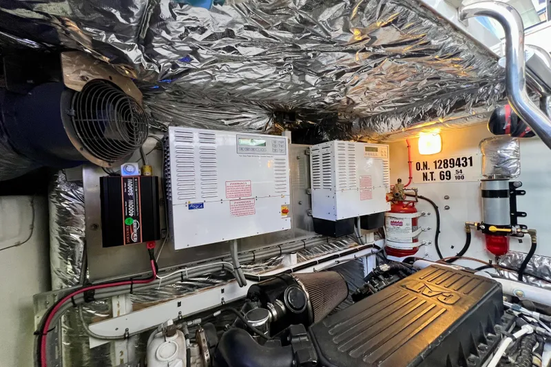  Yacht Photos Pics Engine room of 2010 Princess V78 yacht with electrical systems and fire extinguisher.