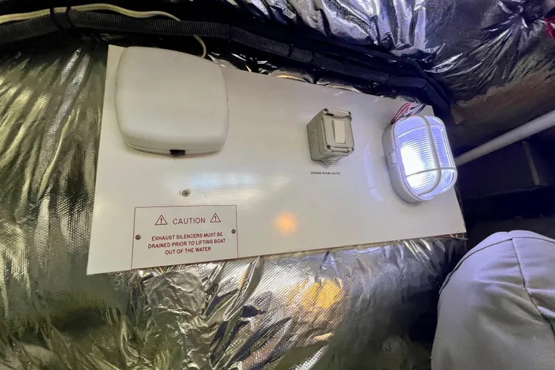  Yacht Photos Pics Engine room panel with caution sign on 2010 Princess V78 yacht.