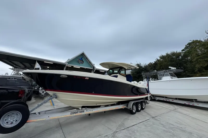  Yacht Photos Pics 2020 Chris-Craft Catalina 30 boat on trailer at marina, overcast sky.