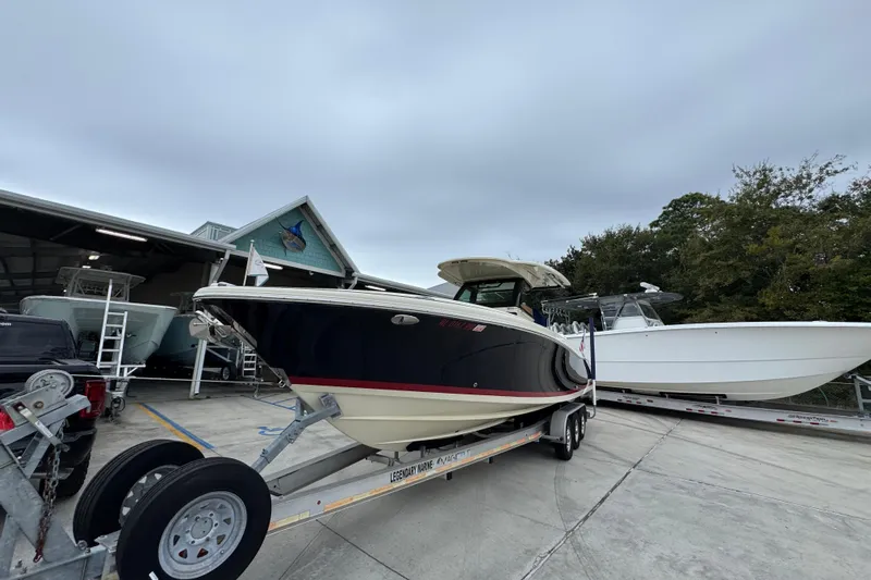  Yacht Photos Pics 2020 Chris-Craft Catalina 30 boat on trailer at marina, overcast sky.